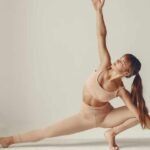 A white women doing hyperbolic stretching